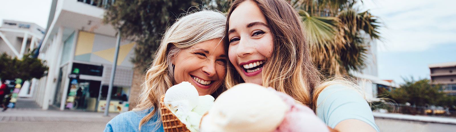 mom and reenage daugher having ice cream