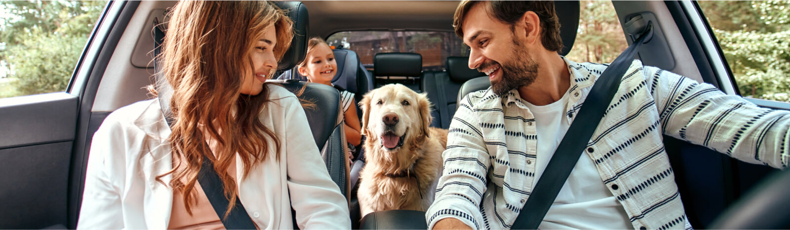 Family and dog in car