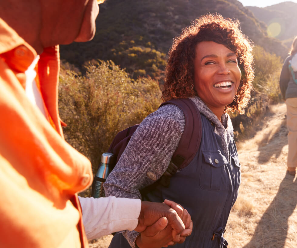 Mature woman with man on hike